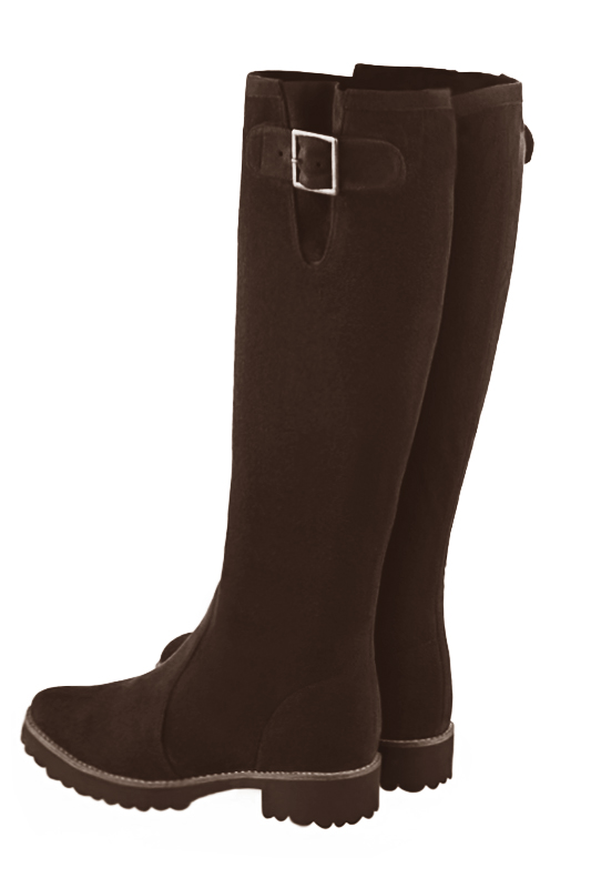 Dark brown knee high boots with buckles. Round toe. Flat rubber